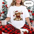 Christmas Highland Cow T-Shirt, Cute Santa Hat Highland Cow Graphic Tee, Xmas Snowflake Ornament Holiday Top, Women's Christmas Gift Shirt